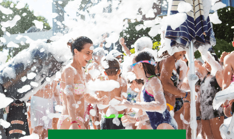 People having fun at an outdoor foam party.