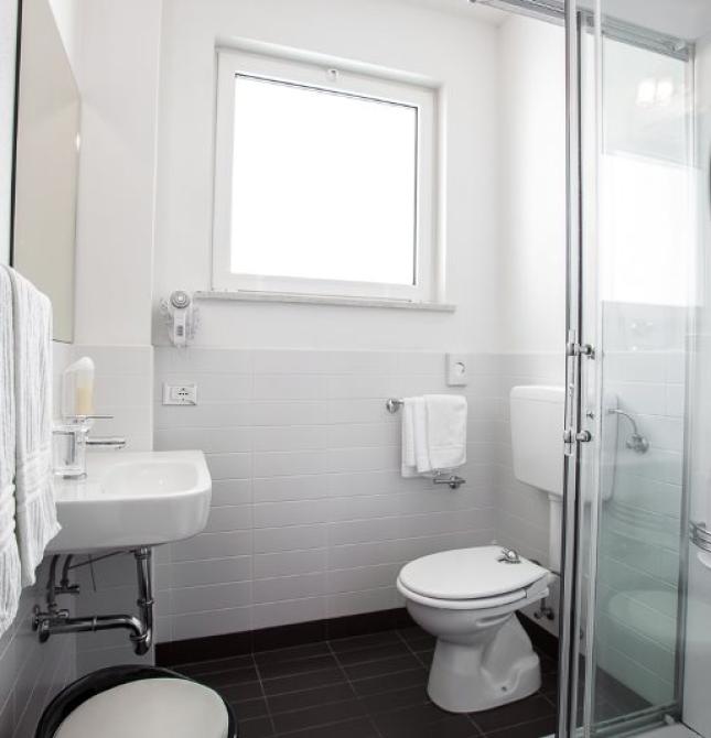 Bright, modern bathroom with a sleek glass shower.